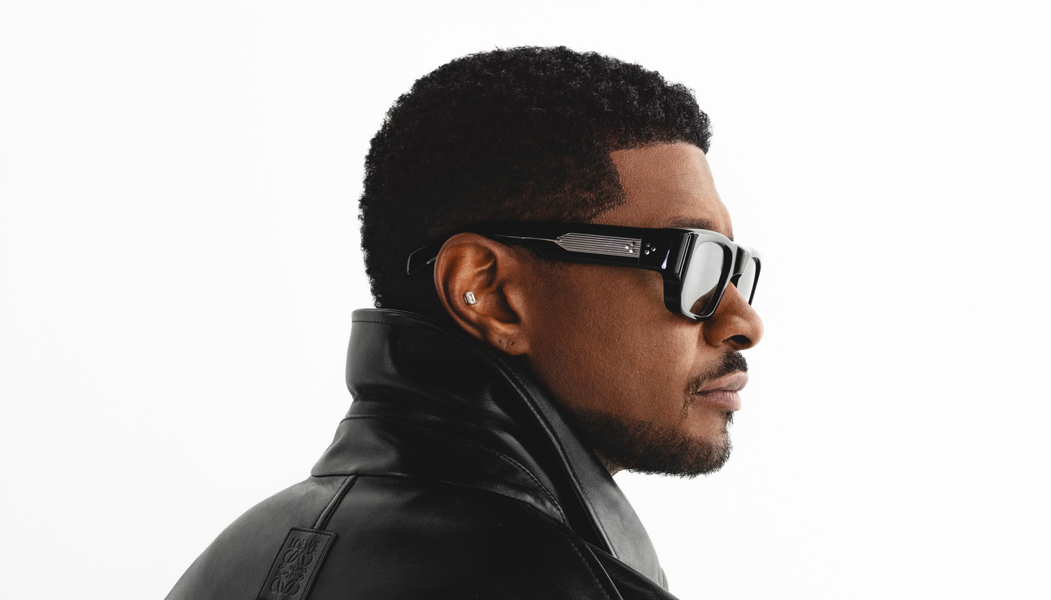 Usher wearing sunglasses banner